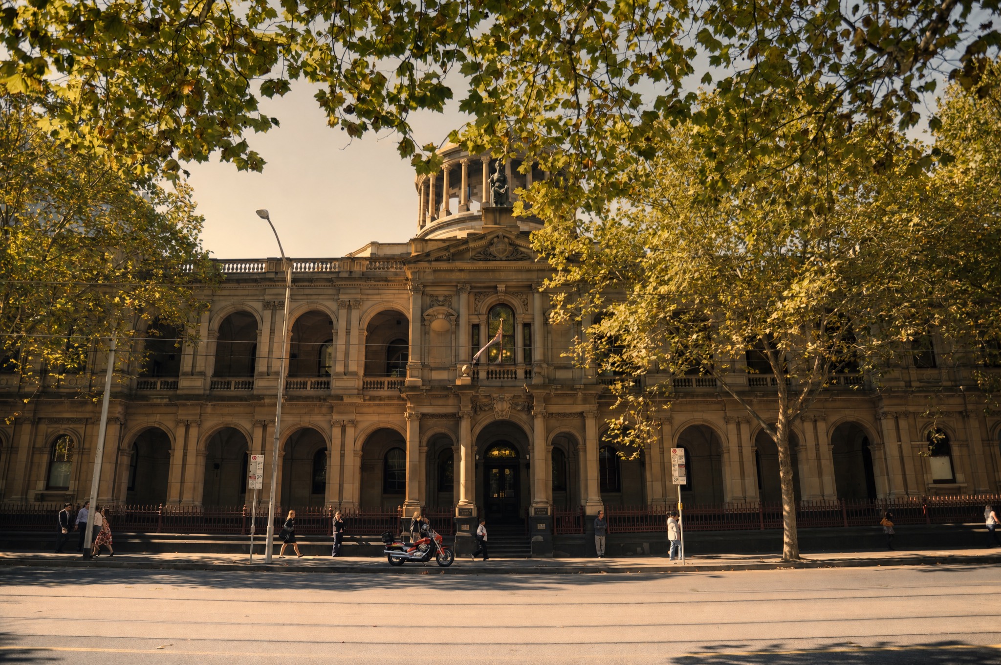 The Supreme Court's arcaded William Street elevation and dome in low warm light